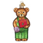 Glass Corduroy bear ornament holding a book with a purple item, on a white background