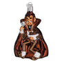 Glass ornament of a Count Chocula with a cape and staff on a white background