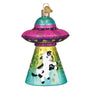 Decorative ornament with a cow inside a UFO on a white background
