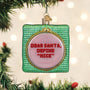 Cross Stitched glass ornament with a sassy saying Dear Santa define "Nice" on tree with lights