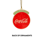 Back of dimensional Coca-Cola Santa disc ornaments with red Enjoy Coca-Cola design