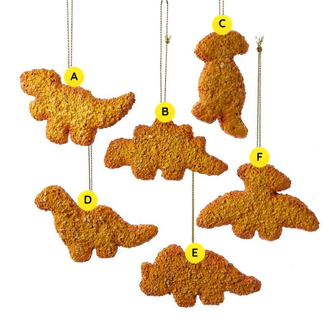 Six dinosaur chicken nugget ornaments in assorted shapes, including T-Rex, stegosaurus, long neck dinosaur, triceratops, and pterodactyl designs.