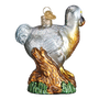 Glass ornament of a dodo bird on a branch with a white background back view