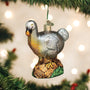 Decorative Dodo Bird ornament hanging on a Christmas tree with lights in the background
