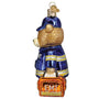 Glass ornament of a bear wearing an EMT uniform with a backpack on a white background