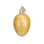 Yellow glittery egg shaped Christmas ornament on a white background