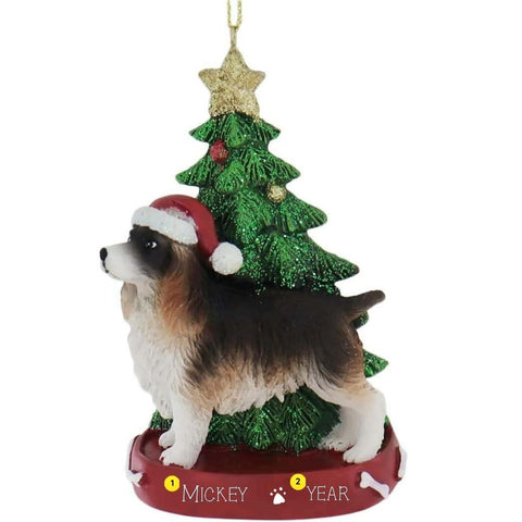 Dog Christmas ornament with a tree and Santa hat on a white background