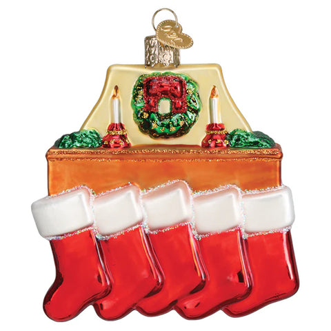 Decorative Christmas ornament with stockings and candles on a white background