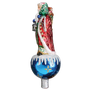 Side view of Father Christmas tree topper showing the flowing red robe, lantern, basket, and blue ornament-style base.