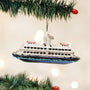 A Ferry ornament hanging on a Christmas tree with lights and decorations.