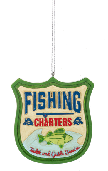 Shield-shaped fishing ornament with a green border, blue and red “Fishing Charters” lettering, and a green fish above “Tackle and Guide Service.”
