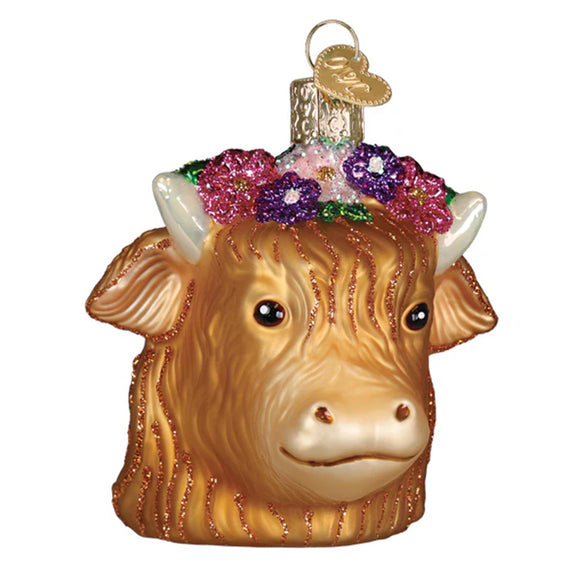 Glass floral highland cow ornament with floral crown on a white background
