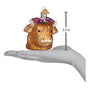 Decorative cow ornament with floral crown on a hand palm, showing measurement of 3.5 inches.