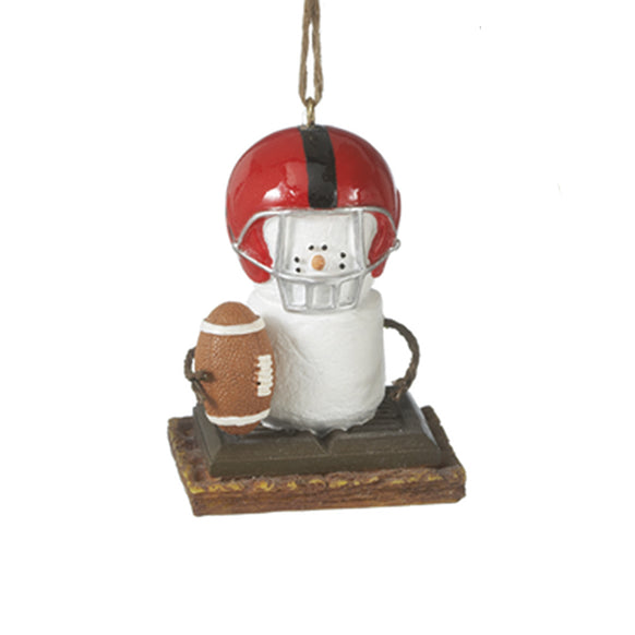 Decorative ornament of a snowman s'more wearing a football helmet and holding a football on a white background.