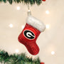 Red glittery Christmas stocking ornament with a Georgia logo on a decorated tree.