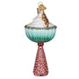 Decorative Martini glass with gingerbread man ornament with a pink base and blue top on a white background