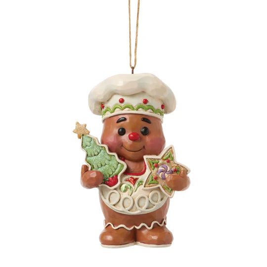 Jim Shore Gingerbread with Cookies Ornament featuring a smiling gingerbread character holding a Christmas tree cookie and star cookie, front view.