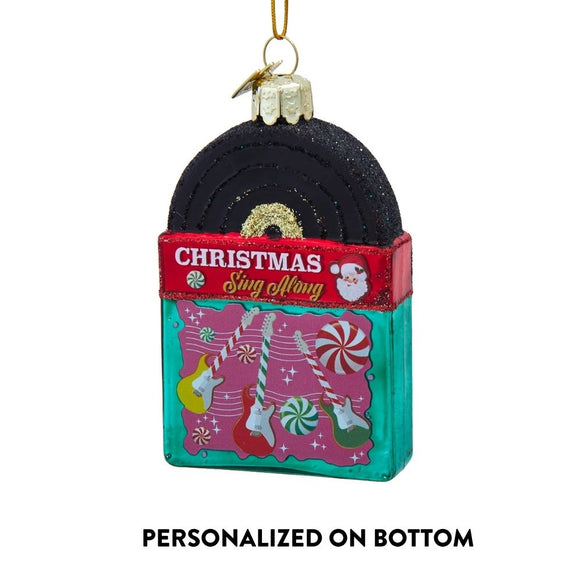Personalized glass Christmas record ornament with text noting personalization on bottom, black record, and colorful holiday album art.