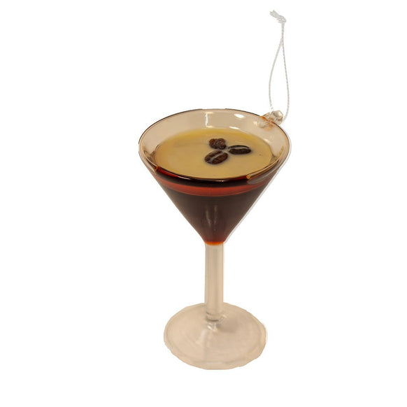 Glass ornament shaped like an espresso martini in a stemmed cocktail glass with a creamy top and three coffee beans.