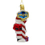 Back view of Santa at the North Pole ornament with red and white striped pole, blue and gold sign detail, Santa, and small gift.
