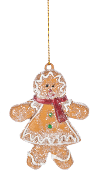 Glittered Gingerbread Girl ornament with icing details, a smiling face, and a layered cookie-style dress decorated with white red, and green accents.