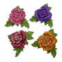 Four glitter rose clip-on ornaments in pink, purple, burgundy, and gold with green glitter leaves and layered rose petals.