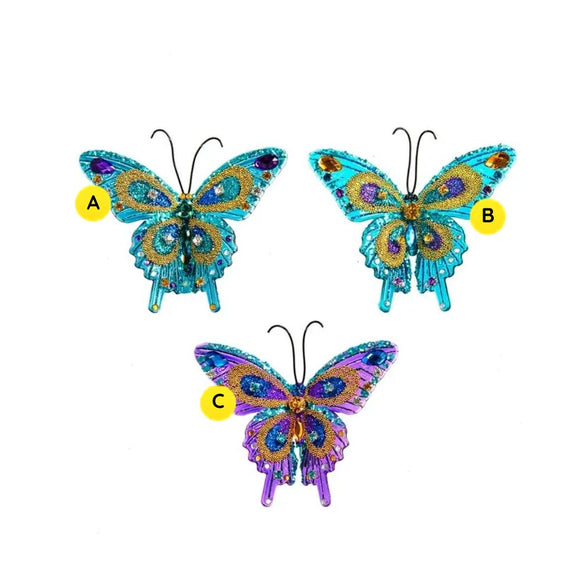 Three glittered jewel butterfly clip ornaments in aqua, turquoise, and purple designs with colorful wing details and black antennae.