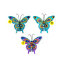 Three glittered jewel butterfly clip ornaments in aqua, turquoise, and purple designs with colorful wing details and black antennae.