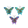 Three glittered jewel butterfly clip ornaments in aqua, turquoise, and purple designs with colorful wing details and black antennae.