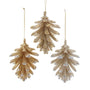 Three gold glittery pine tree-shaped Christmas ornaments on a white background