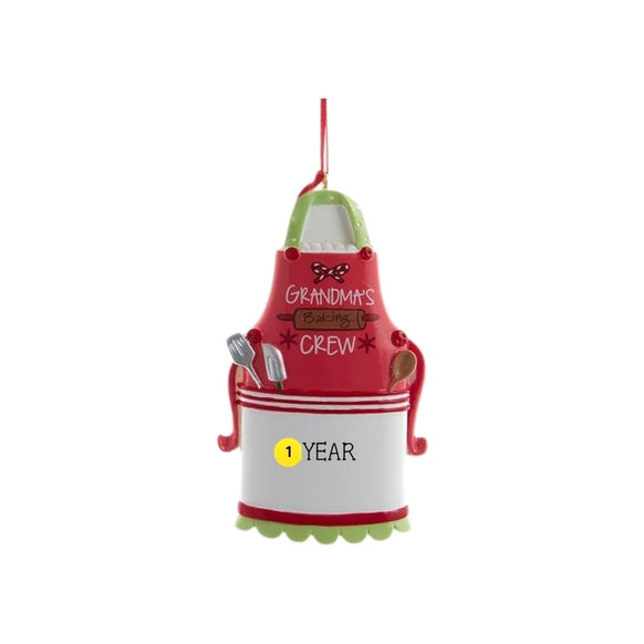 Grandma’s Baking Crew apron ornament with baking tools, festive red and green holiday details, and sample year personalization.