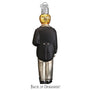 Back view of a glass ornament groom shaped like a person wearing a suit with a gold bulb on their head.