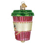 Decorative glass ornament shaped like a pink cup with a green lid on a white background