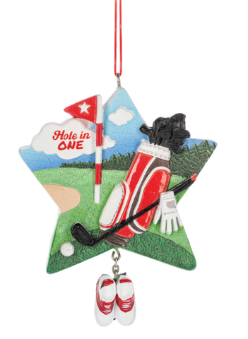 Hole In One Golf ornament featuring a golf course scene on a star-shaped design with a flag, golf bag, clubs, glove, golf ball, and a dangling pair of red and white golf shoes.