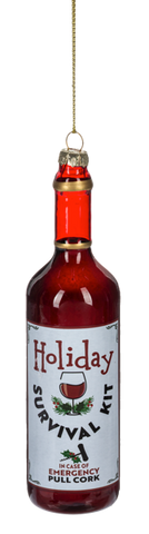 Wine bottle ornament with red wine and a label that reads “Holiday Survival Kit” with a wine glass graphic.