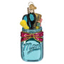Decorative ornament shaped like a blue mason jar with 'Mom' on it, filled with colorful school tools.