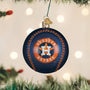 Houston Astros baseball ornament hanging on a Christmas tree with lights in the background