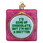 Decorative ornament with text 'I'd give up chocolate, but I'm not a quitter' on a pink background