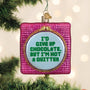 Decorative ornament with text 'I'd give up chocolate, but I'm not a quitter' on a Christmas tree.