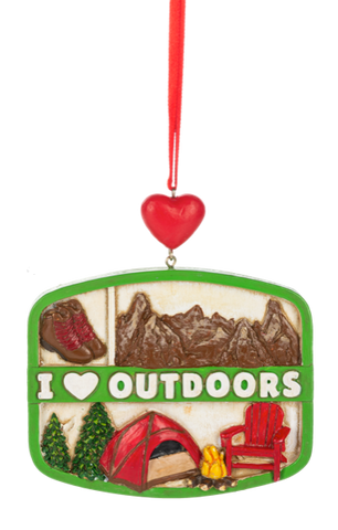 I Love Outdoors collage ornament with a green frame, red heart hanger, and outdoor-themed details including hiking boots, mountains, tent, campfire, pine trees, and chair.