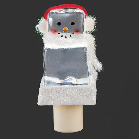 Icecube Snowman Night-Light featuring a clear block-shaped snowman with earmuffs, a white scarf, carrot nose, and glittered snowy base