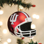 Red football helmet ornament with 'IU' logo on a Christmas tree.