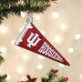 Decorative ornament shaped like a red and white 'IU Hoosiers' pennant on a Christmas tree.