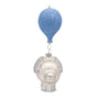 Face view of a blue and silver baby elephant ornament with glittered blue ears, closed eyes, and a blue balloon above.