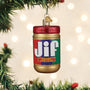 Jif peanut butter jar ornament hanging on a Christmas tree with lights in the background