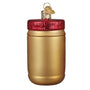 Gold jar ornament with a red lid on a white background