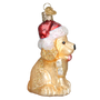 Glass ornament of a dog wearing a Santa hat on a white background