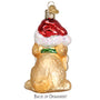 Glass ornament of a dog wearing a Santa hat on a white background