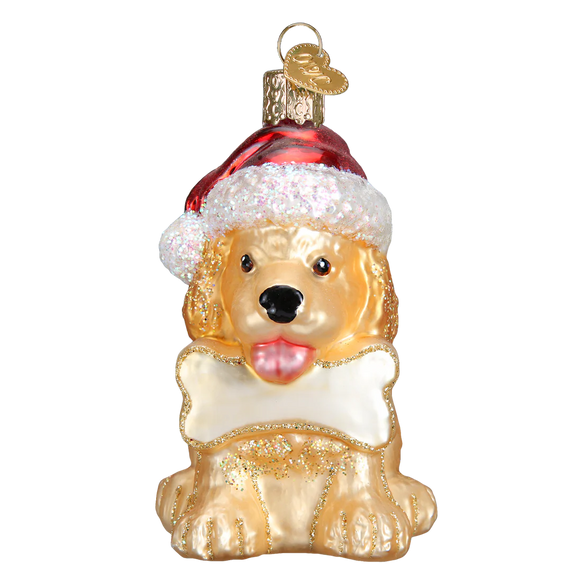 Glass ornament of a dog wearing a Santa hat on a white background