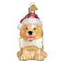 Glass ornament of a dog wearing a Santa hat on a white background